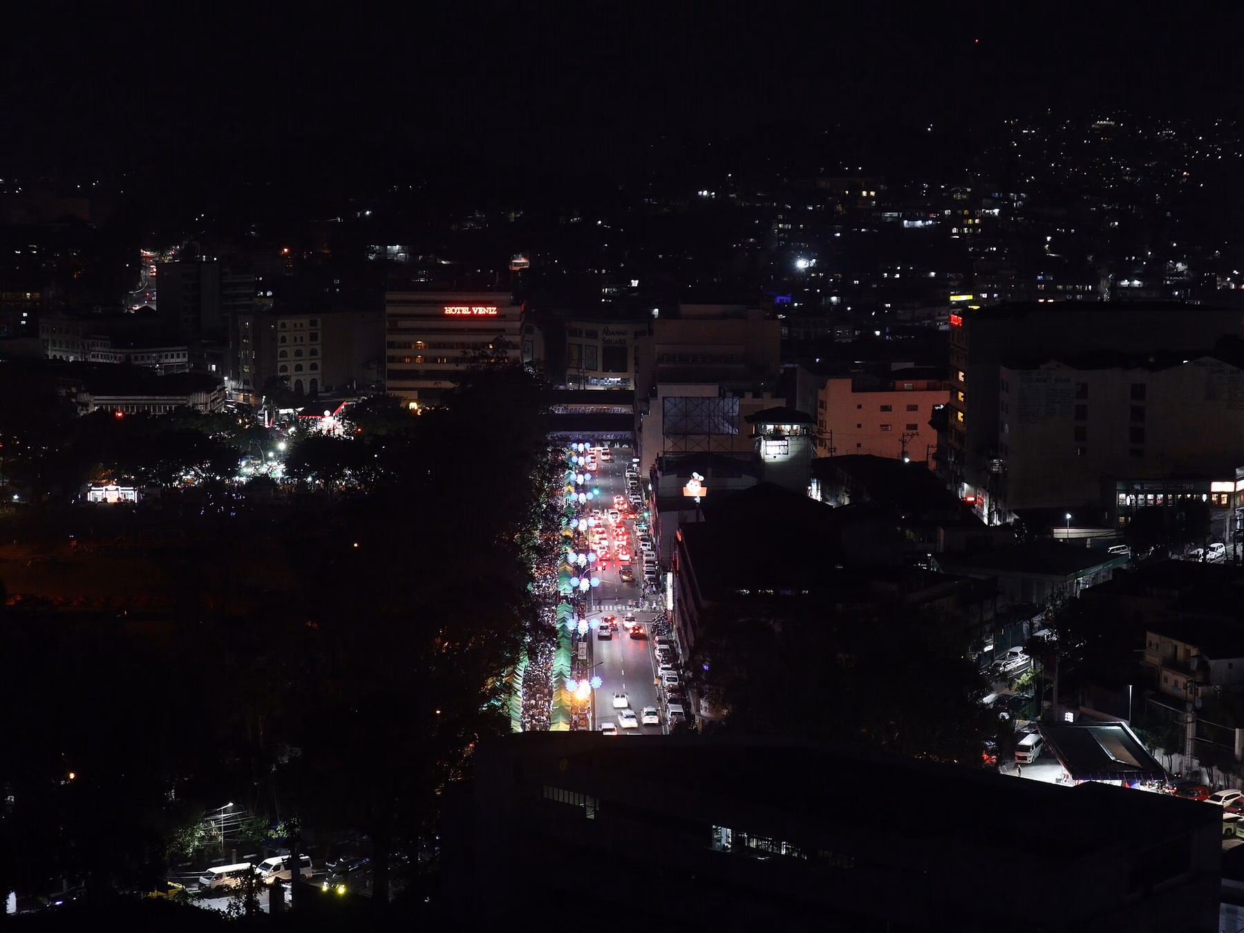 Night view over Harrison Road and central Baguio