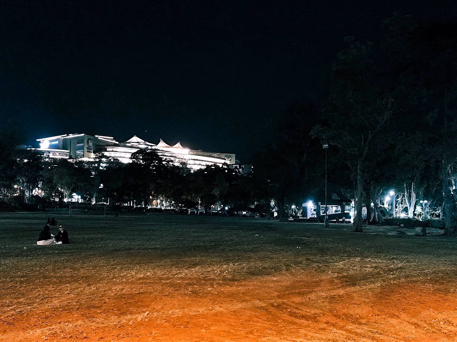 Melvin Jones Grandstand and field near Harrison Road after dark